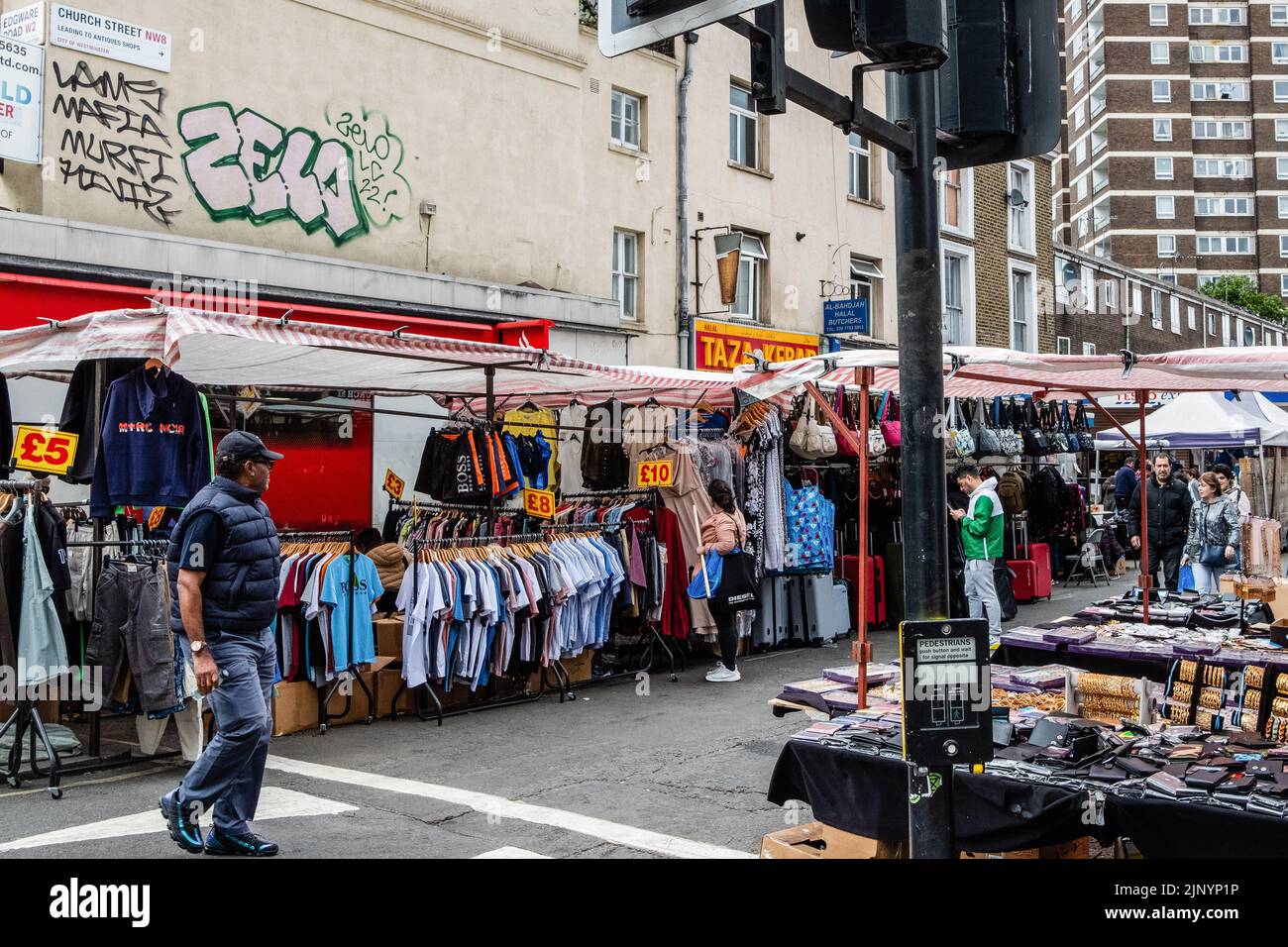 London, UK. 26th May, 2022. Members of the public pass through Church Street market. Church Street, situated in one of London's most multicultural are Stock Photo