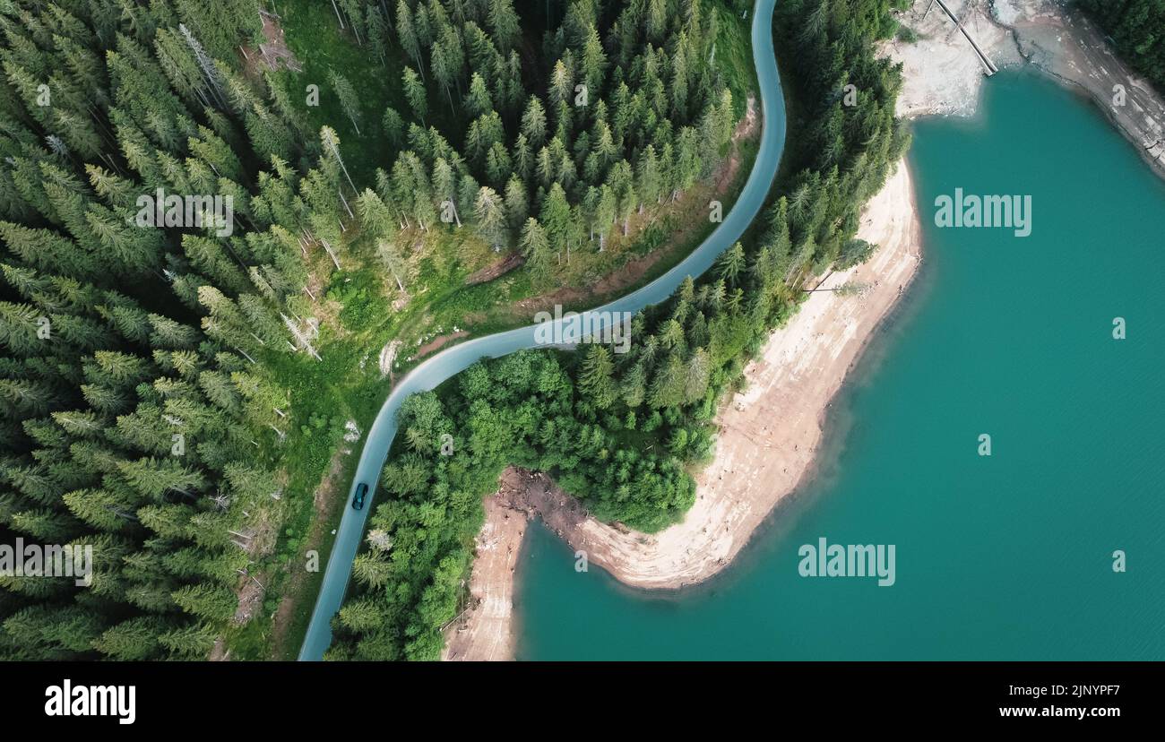 Mountain road & emerald lake Stock Photo Alamy