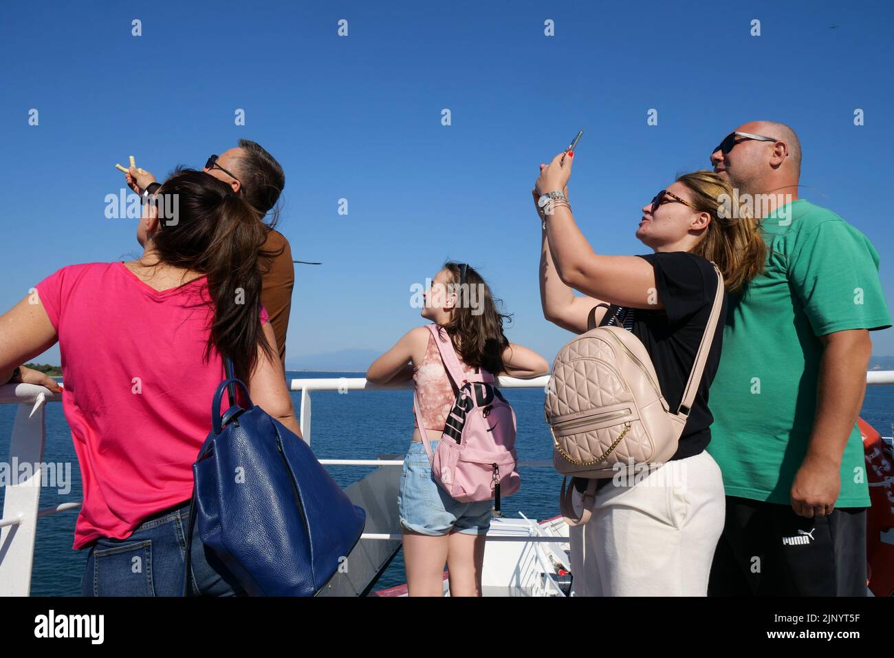 Tourists enjoying a cruise between Kalamari an Thassos island Stock Photo
