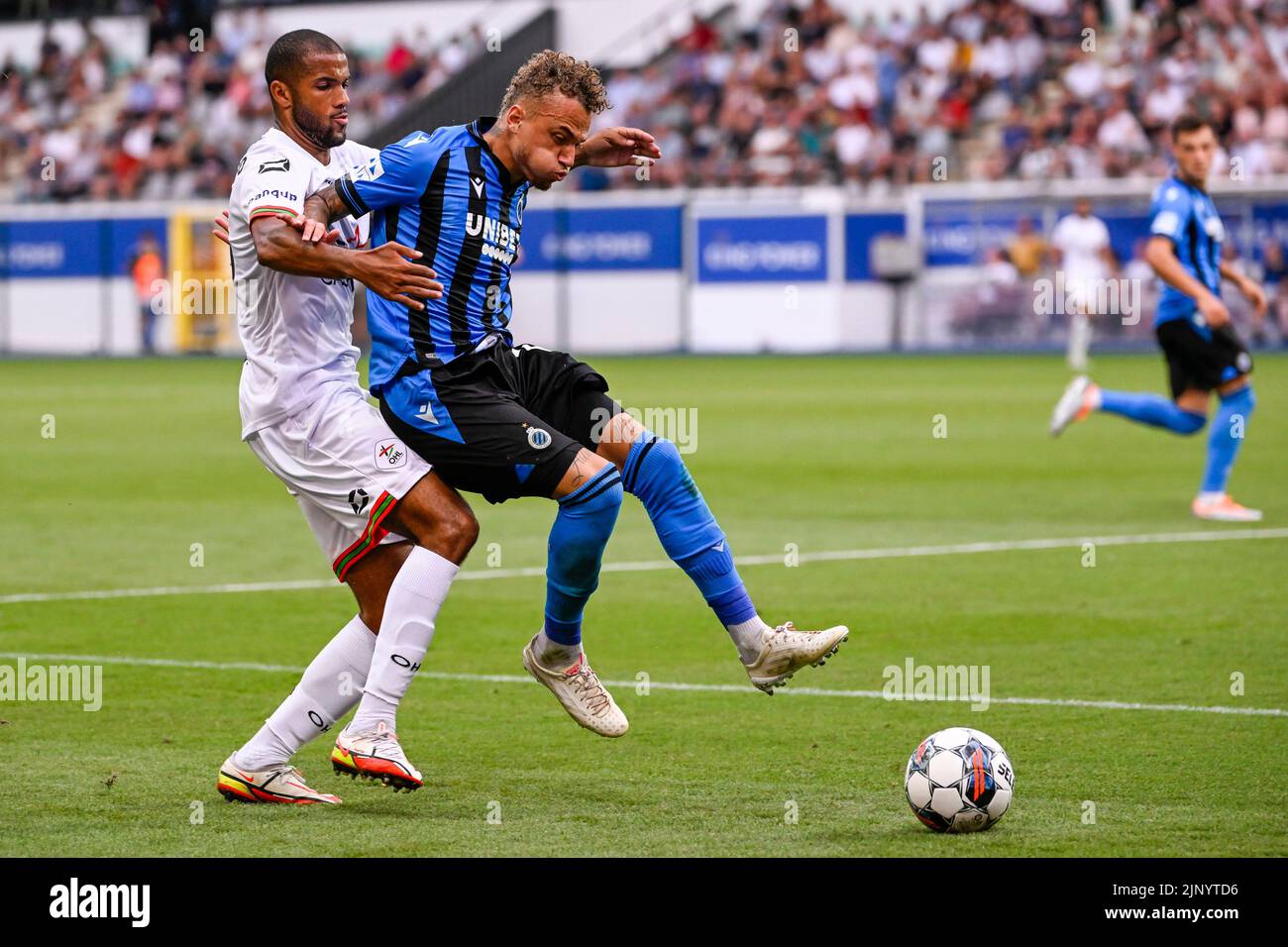 OHL's Dylan Ouedraogo and Club's Noa Lang fight for the ball during a