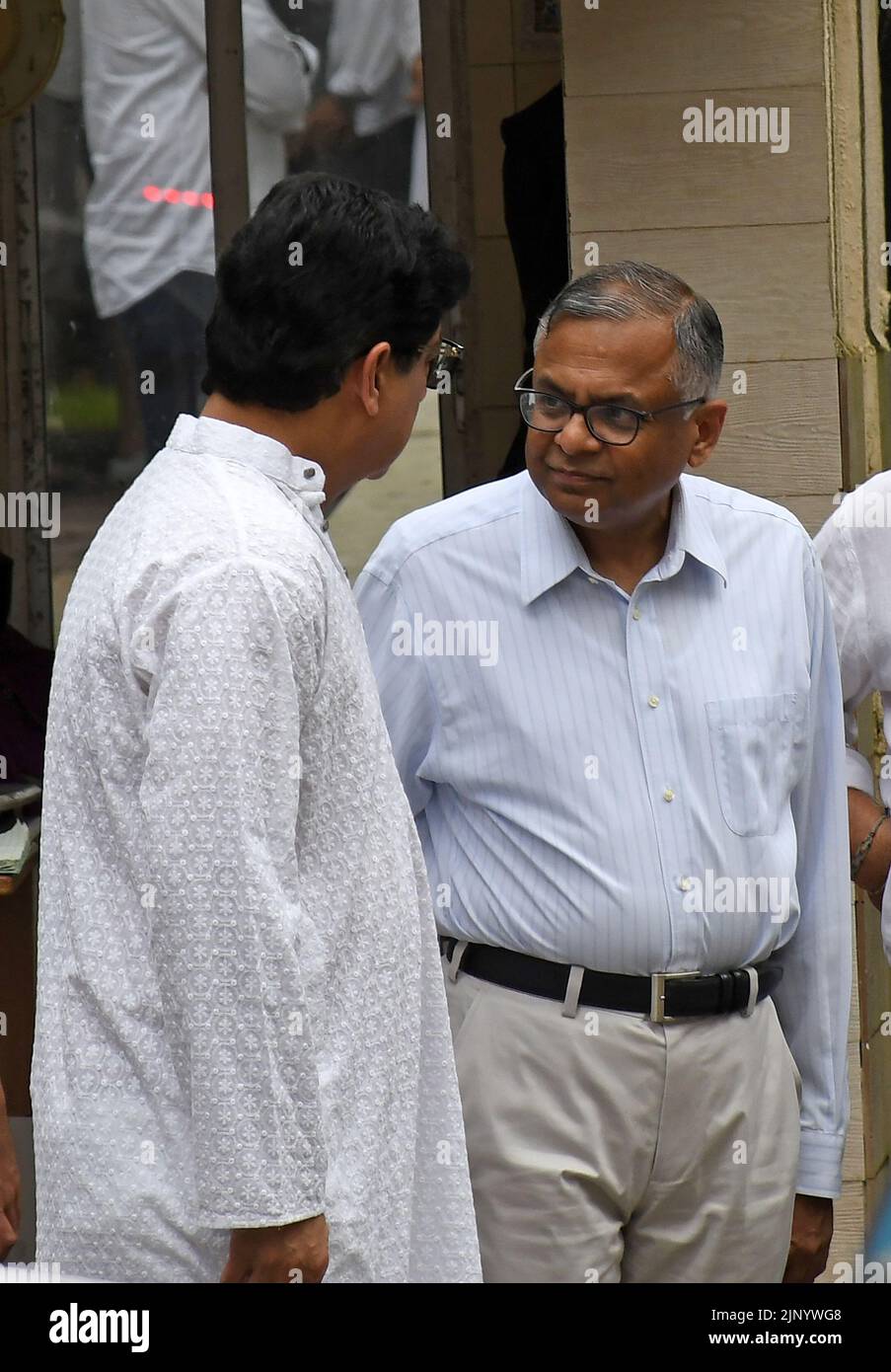 Tata sons chairman Natarajan Chandrasekaran (R) is seen standing ...