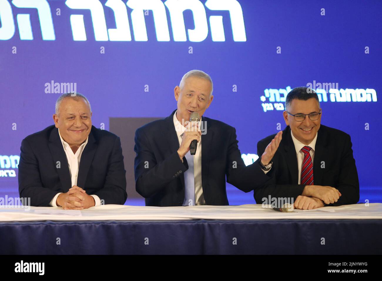 (220814) -- RAMAT GAN, Aug. 14, 2022 (Xinhua) -- Benny Gantz (C), Israel's defense minister and leader of the centrist alliance Blue and White, and Gideon Sa'ar (R), the justice minister and leader of the right-wing New Hope party, and former Israeli military chief Gadi Eisenkot attend a joint press conference in Ramat Gan, Israel, on Aug. 14, 2022. The former Israeli military chief Gadi Eisenkot announced on Sunday that he has joined the alliance of two government ministers to run for the November parliamentary elections. The new three-way alliance will be headed by Gantz, with Sa'ar as his s Stock Photo