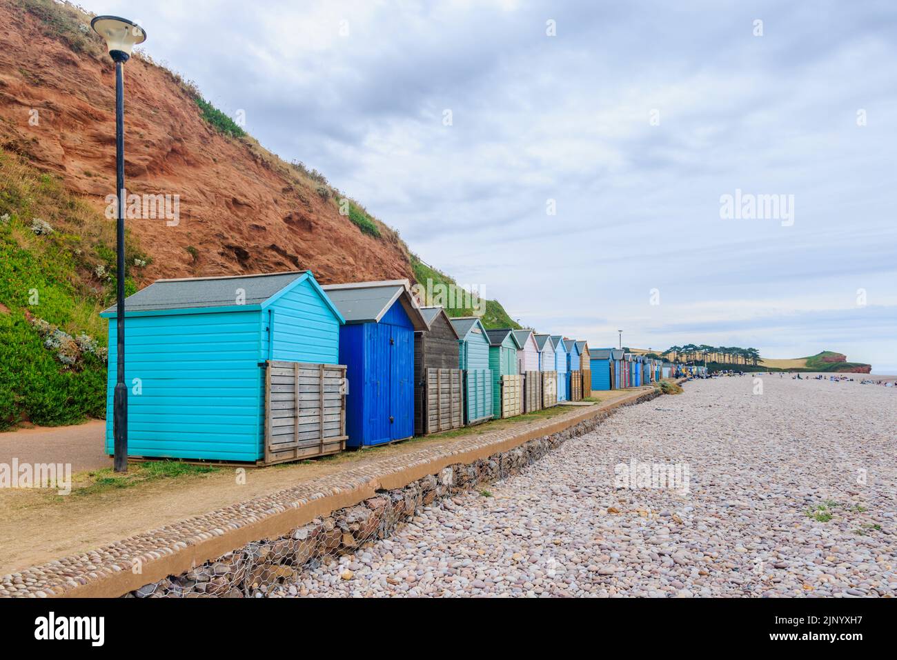 Closed wooden beach huts in the seafront promenade at Budleigh