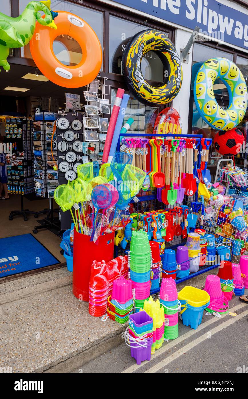 Roadside display of colourful inflatables and beach toys in a shop by