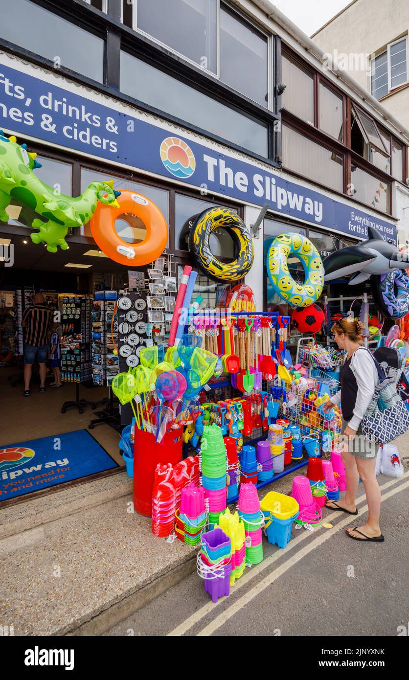 Roadside display of colourful inflatables and beach toys in a shop by