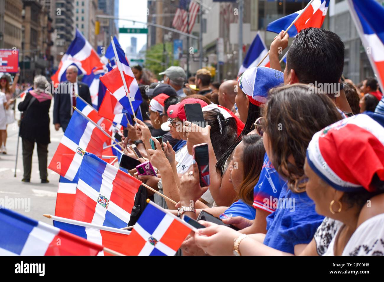 Dominican New Yorkers are seen waving flags during the annual Dominican
