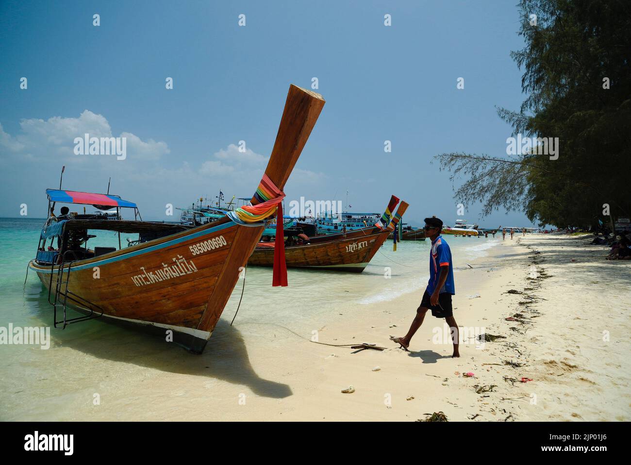 Beach on Koh Kradan Island in the Andaman Sea. Traditional Thai boats
