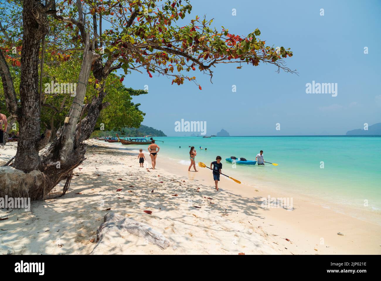 Beach on Koh Kradan Island in the Andaman Sea. Traditional Thai boats