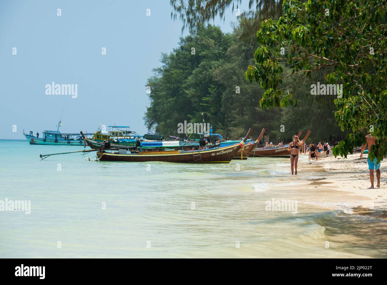 Beach on Koh Kradan Island in the Andaman Sea. Traditional Thai boats