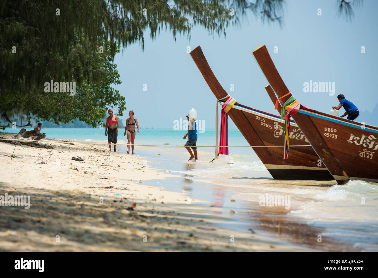 Beach on Koh Kradan Island in the Andaman Sea. Traditional Thai boats