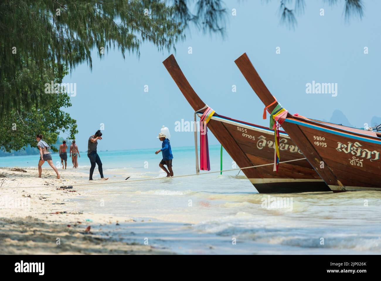 Beach on Koh Kradan Island in the Andaman Sea. Traditional Thai boats