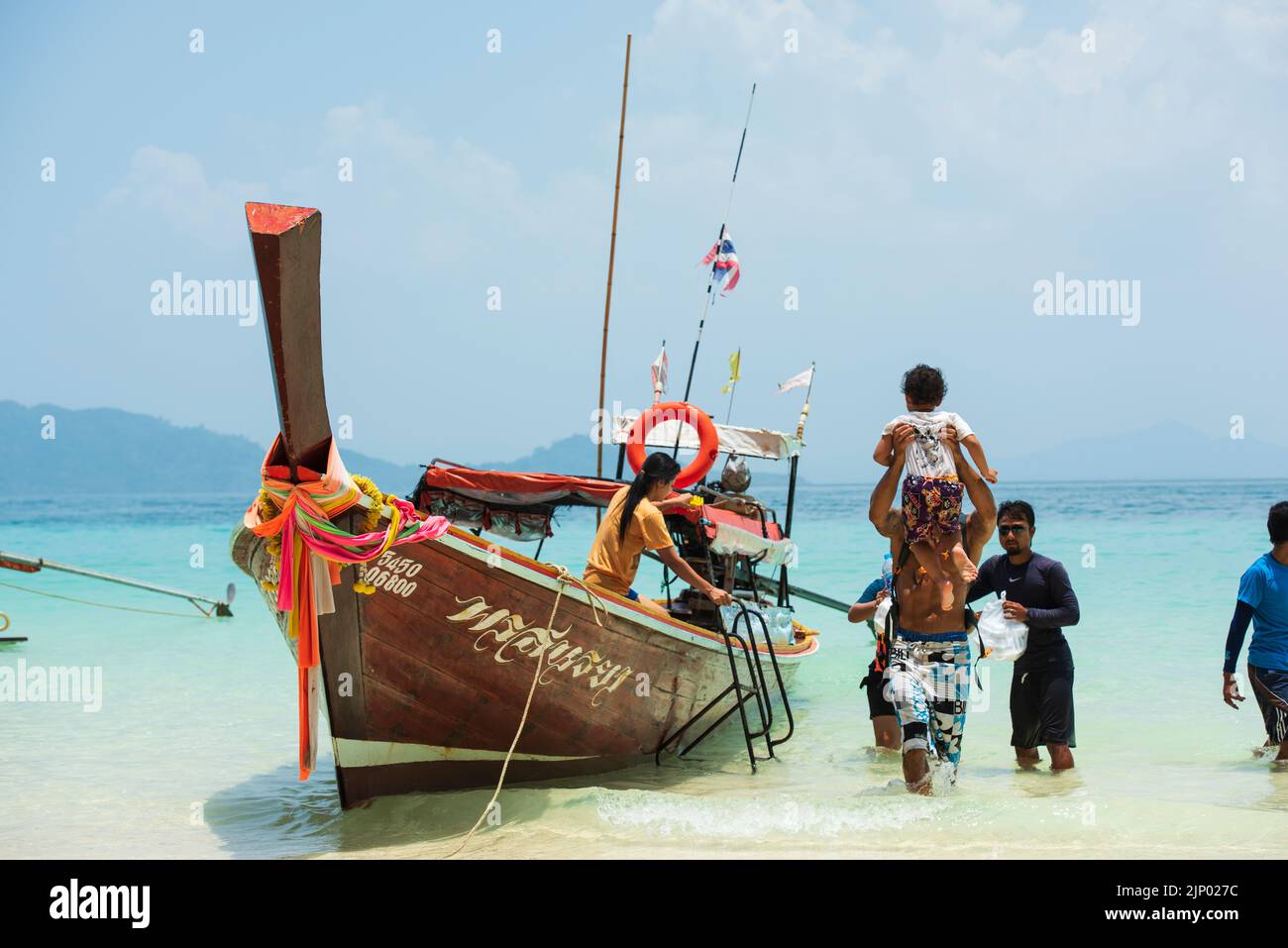 Beach on Koh Kradan Island in the Andaman Sea. Traditional Thai boats