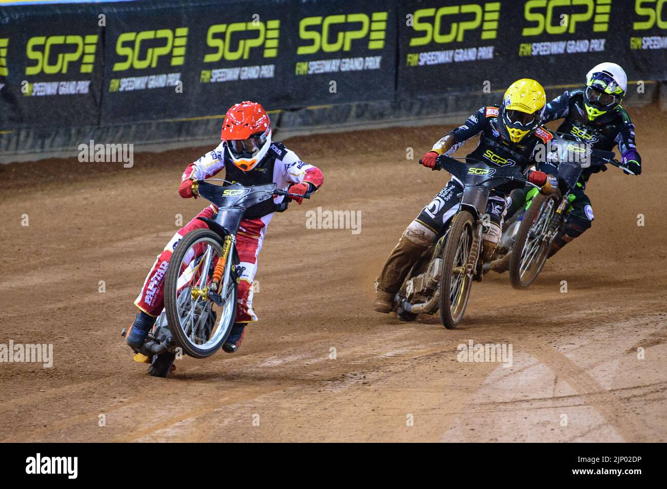 Mateusz Cierniak (Poland) (Red) picks up some drive coming out of the 2nd turn ahead of Norick Blodorn (Germany) (Yellow) and Tom Brennan (Great Britain) (White) during the FIM Speedway Grand Prix 2 of Great Britain at the Principality Stadium, Cardiff on Sunday 14th August 2022. (Credit: Ian Charles | MI News) Credit: MI News & Sport /Alamy Live News Stock Photo
