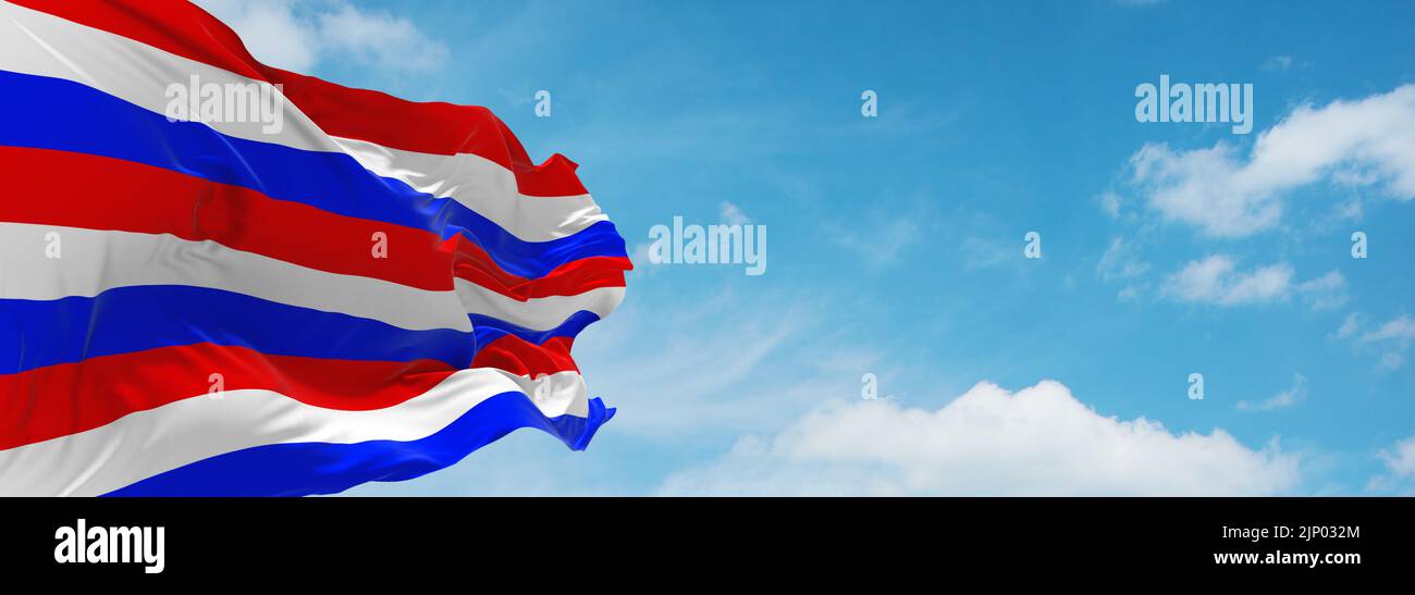 flag of Austronesian peoples Balinese people at cloudy sky background, panoramic view.flag representing ethnic group or culture, regional authorities. Stock Photo