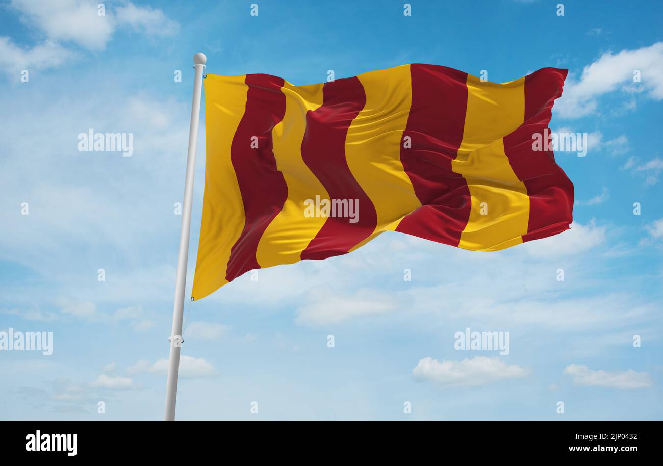 flag of Anglo-Frisian peoples Northumbrians at cloudy sky background ...