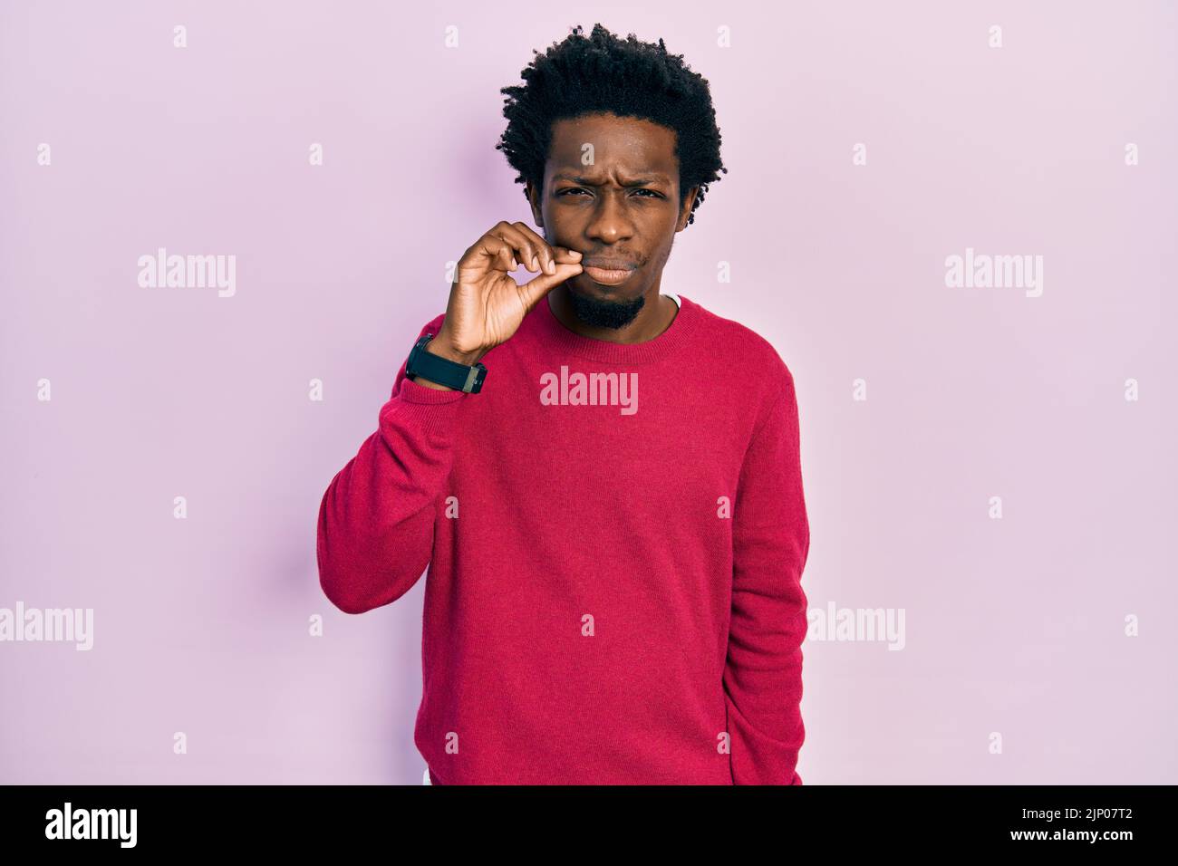 Young african american man wearing casual clothes mouth and lips shut ...