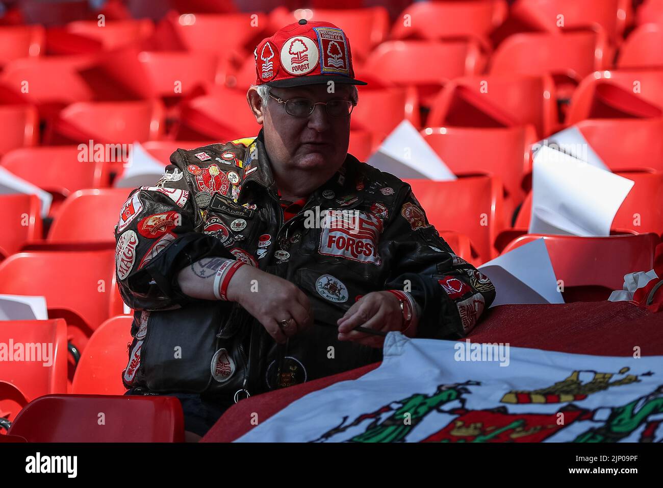 A Nottingham Forest fan arrives at the game prior to kick off Stock Photo