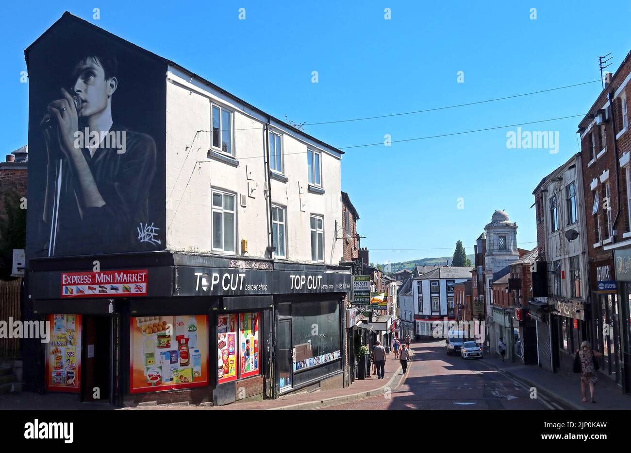 One of the most famous inhabitants of Macclesfield -  Ian Kevin Curtis, painted as mural in Mill St by street artist Akse Stock Photo