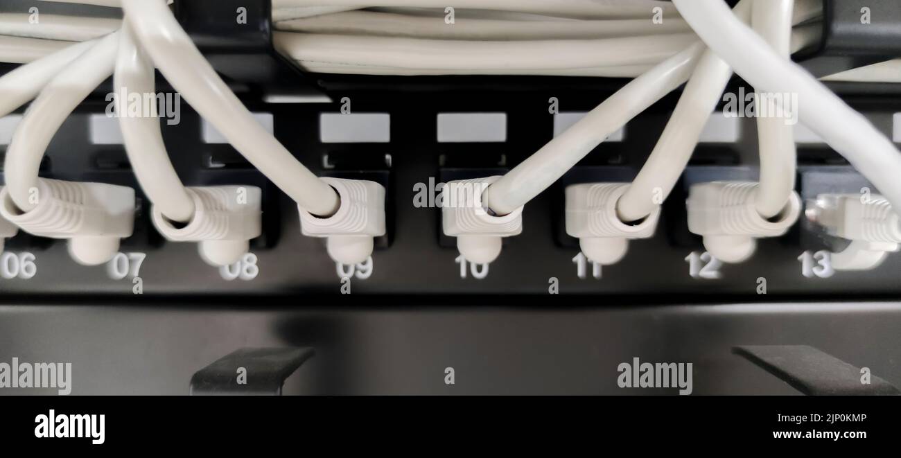 Ethernet Switch device full of wires. Closeup Stock Photo