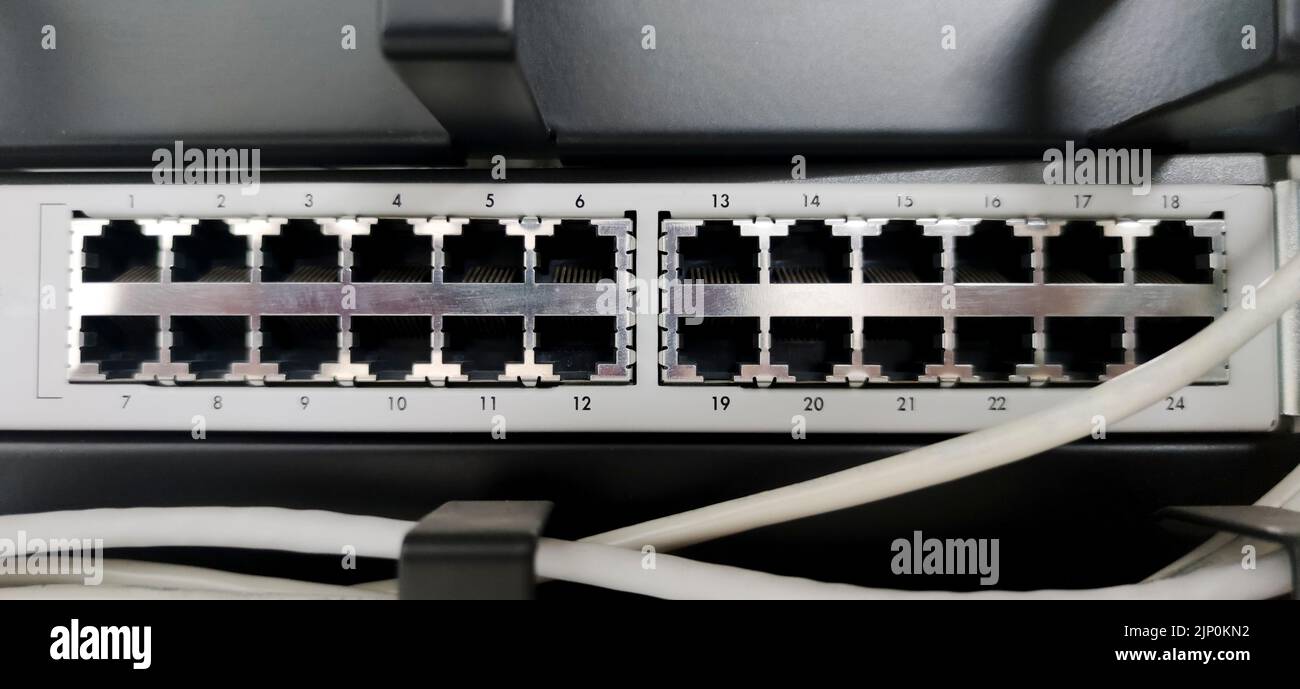 Ethernet Switch device full of wires. Closeup Stock Photo