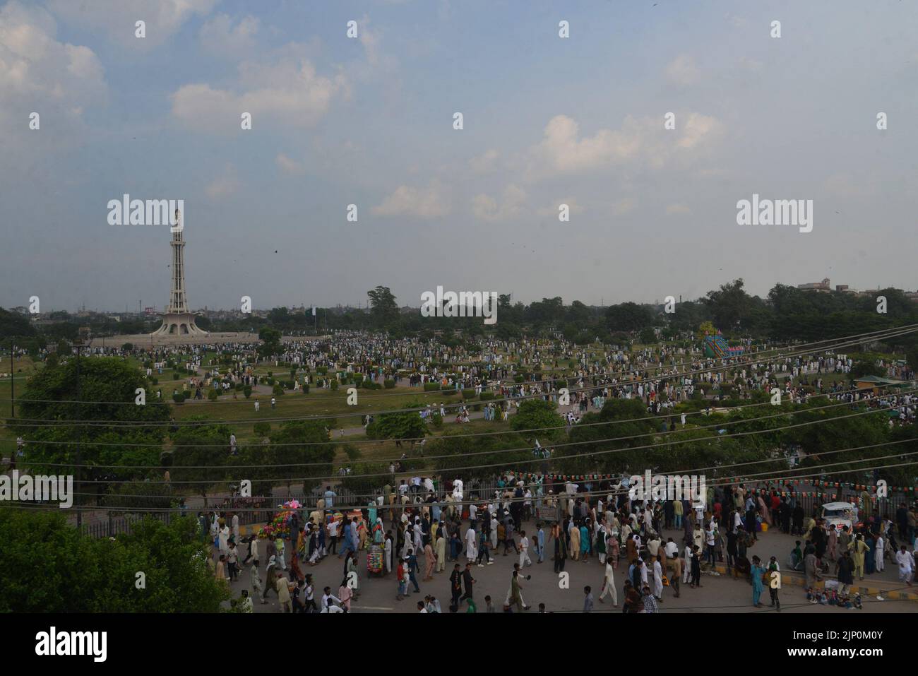 Lahore, Punjab, Pakistan. 14th Aug, 2022. Pakistani people take a part in the 75th Independence day celebrations in Lahore. Independence Day (Y?um-e-?z?di), observed annually on 14 August, is a national holiday in Pakistan. It commemorates the day when Pakistan achieved independence and was declared a sovereign state following the end of the British Raj in 1947. Pakistan came into existence as a result of the Pakistan Movement, which aimed to create an independent Muslim state in the north-western regions of British India via partition. The All-India Muslim League led the movement under the l Stock Photo