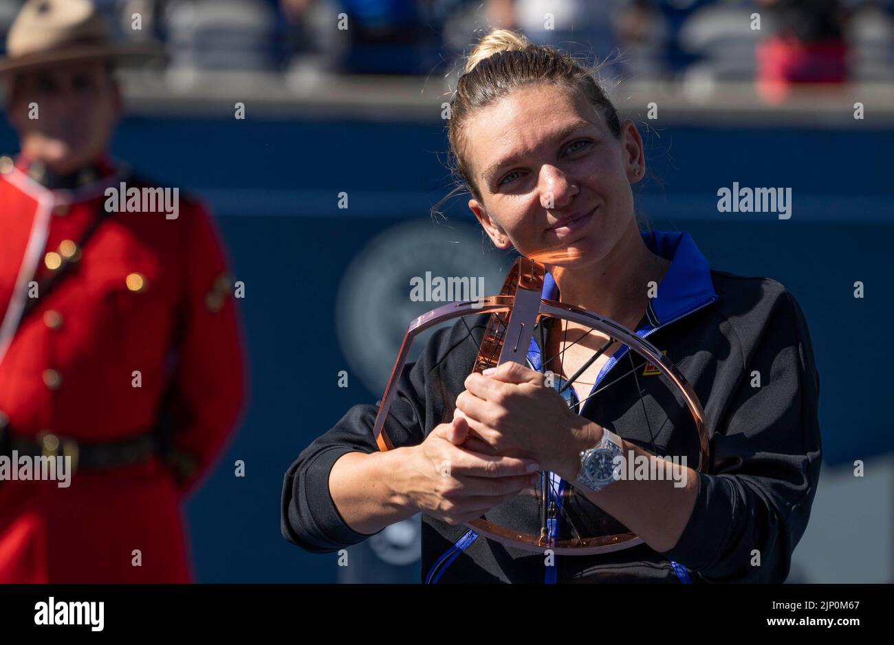 Toronto, Canada. 14th Aug, 2022. Simona Halep of Romania poses for photos with her trophy during the awarding ceremony after the women's singles final between Beatriz Haddad Maia of Brazil and Simona Halep of Romania at the 2022 National Bank Open tennis tournament in Toronto, Canada, Aug. 14, 2022. Credit: Zou Zheng/Xinhua/Alamy Live News Stock Photo