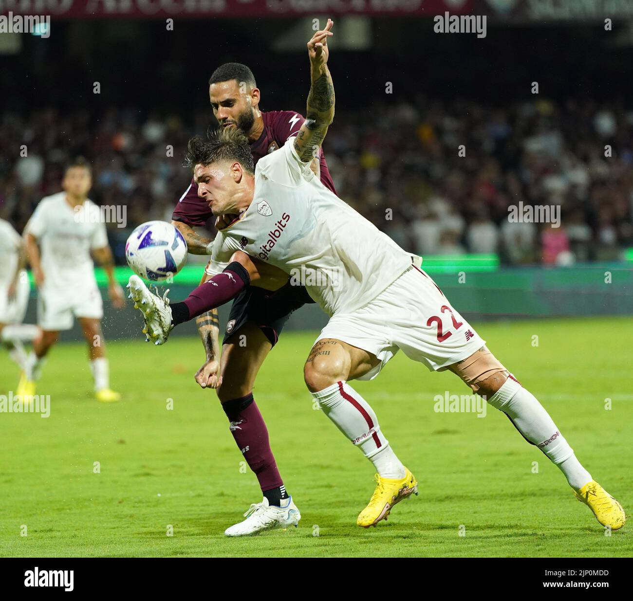 Salerno, Italy. 14th Aug, 2022. Roma's Nicolo Zaniolo (R) vies with Salernitana's Dylan Bronn during their Serie A football match in Salerno, Italy, on Aug. 14, 2022. Credit: Str/Xinhua/Alamy Live News Stock Photo