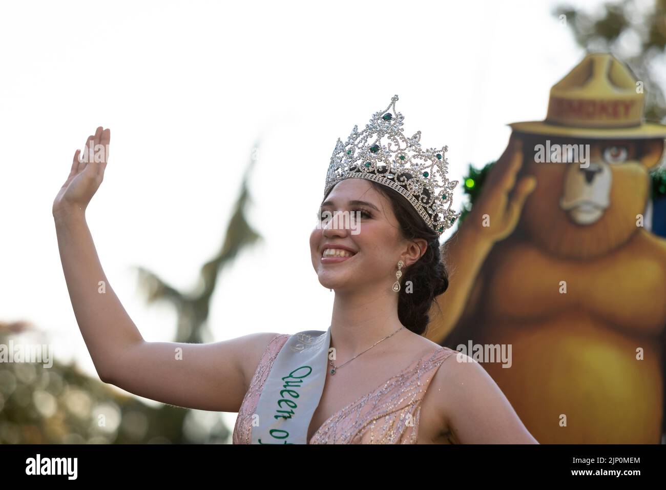 A member of the the Forest Festival Royalty serves as “Queen of the Forest” at the Seafair Torchlight Parade in Seattle on Saturday, July 30, 2022. Stock Photo