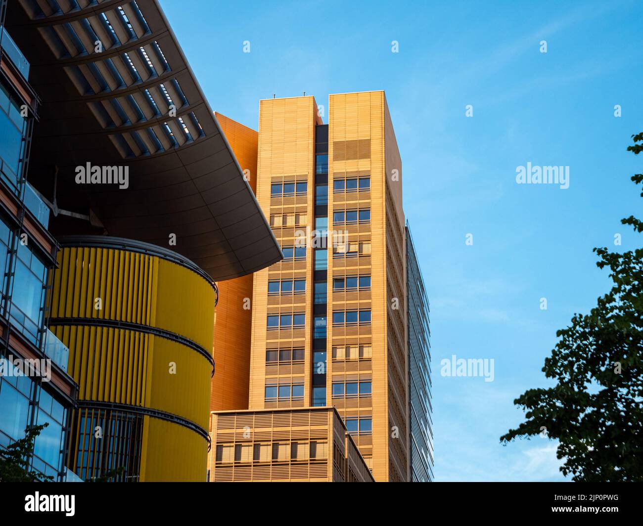 Architecture by Richard Rogers in the front and a high rise building designed by Renzo Piano in the background. Office houses at the Potsdamer Platz. Stock Photo