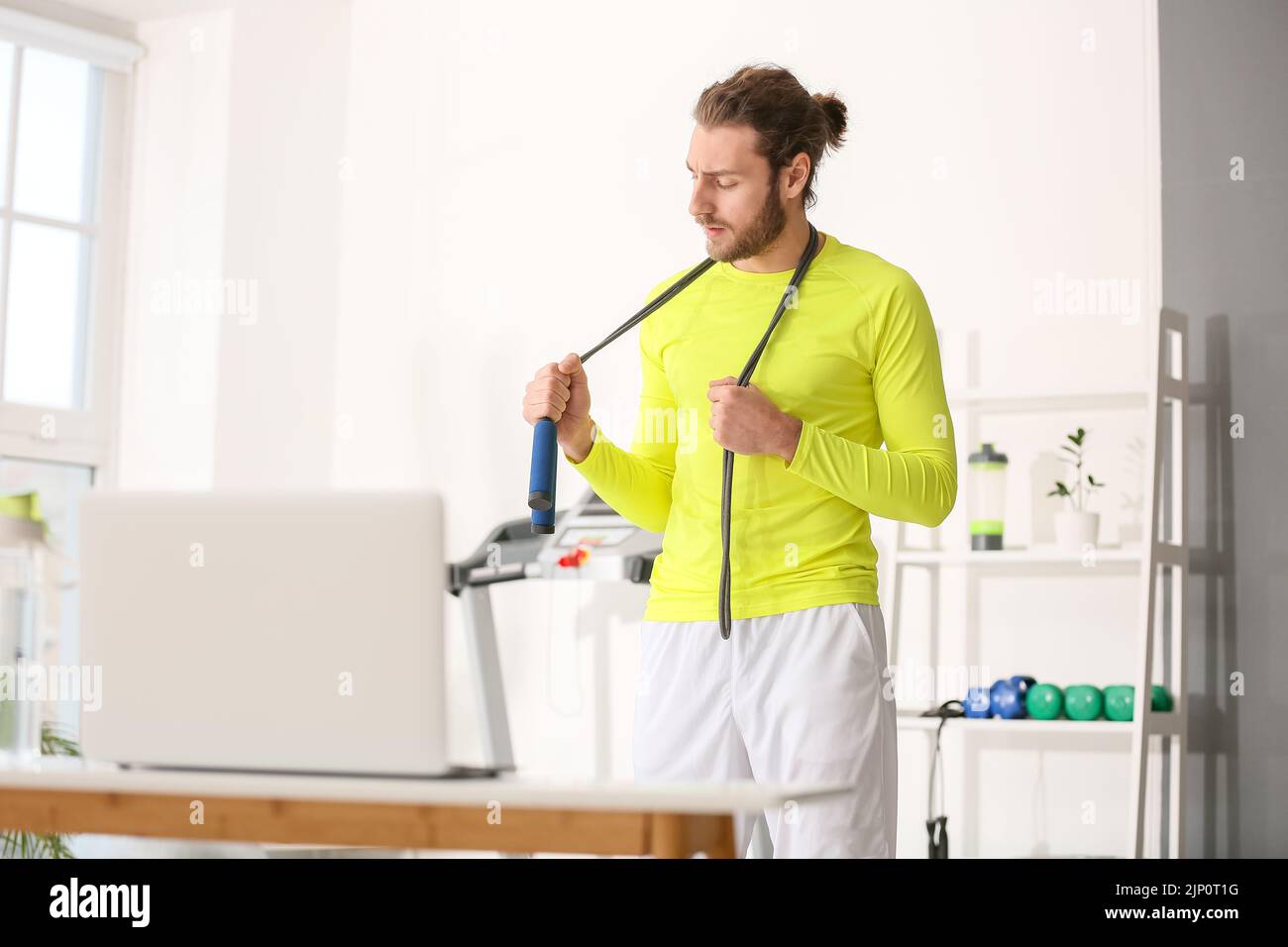 Man jumping using laptop hi-res stock photography and images - Alamy