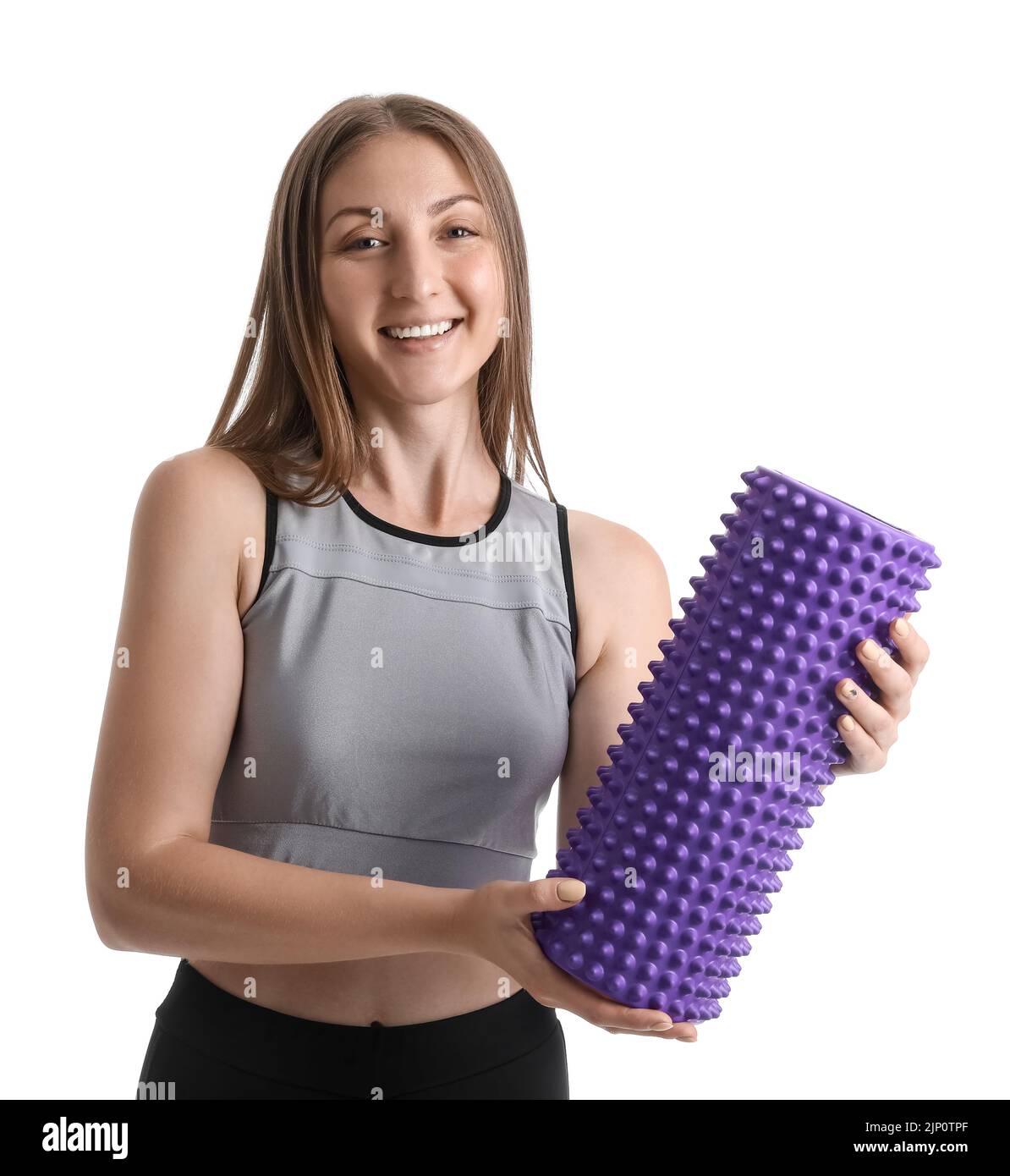 Young woman with foam roller on white background Stock Photo - Alamy
