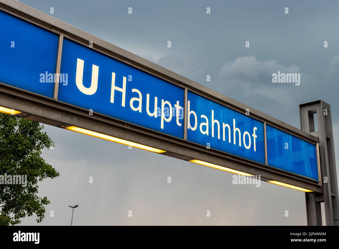 Berlin U-Bahn station Hauptbahnhof (main station). Underground entrance with white letters on a blue background. Illuminated name of the station. Stock Photo