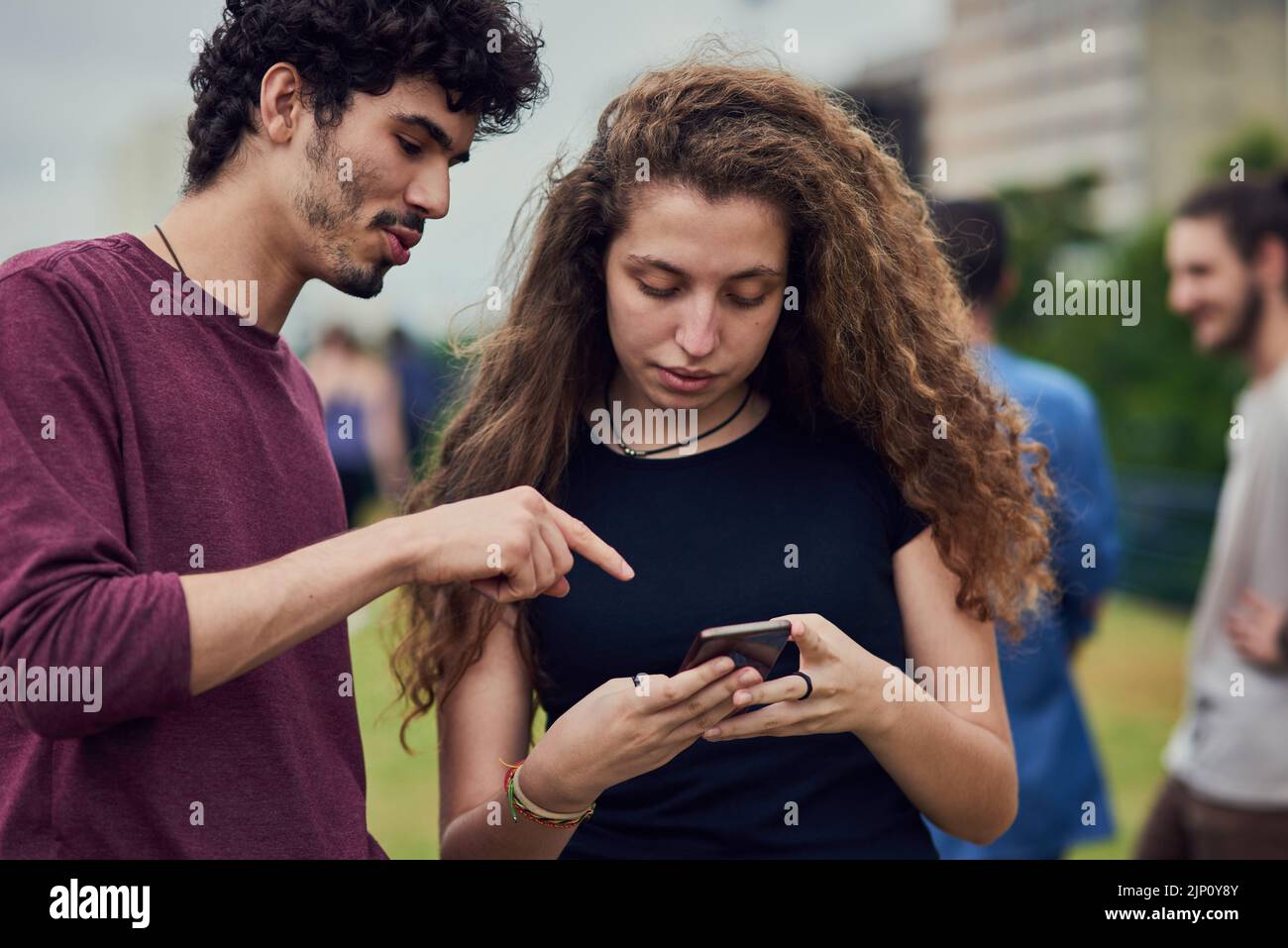Yes thats how you spell my name. two cheerful young friends browsing on