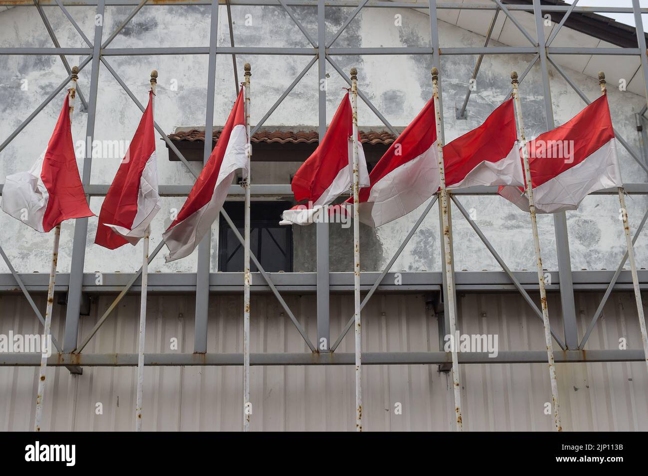 Indonesian flags waving in the sky Stock Photo