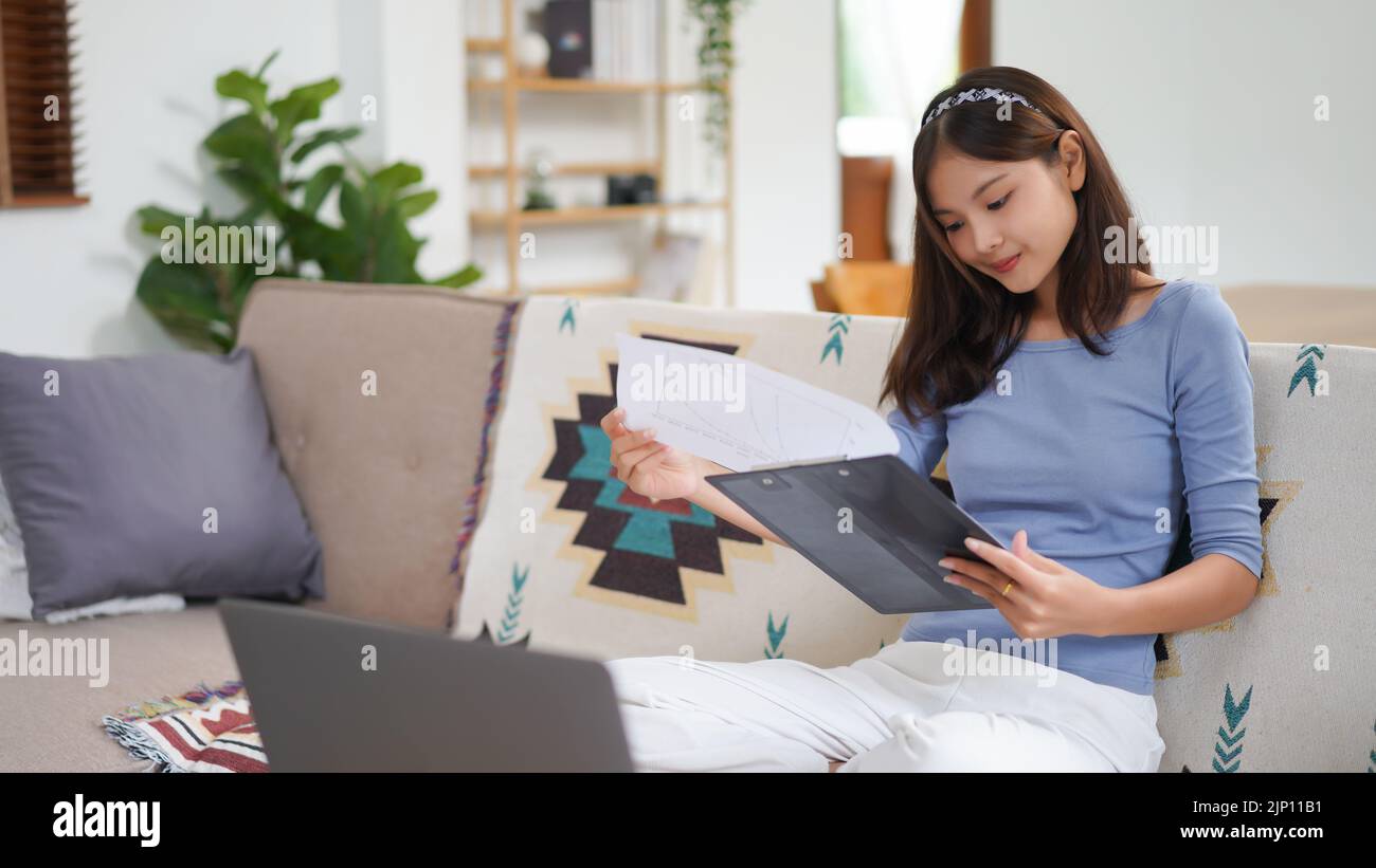 Work from home concept, Business women reading chart financial data