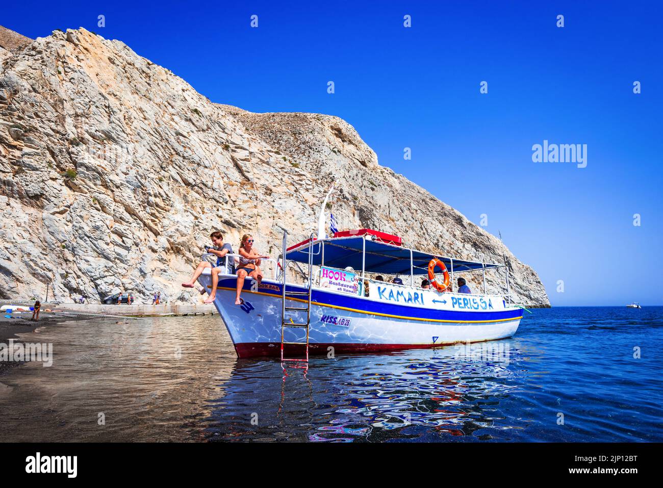 Santorini, Greece - September 2017: Famous Black Beach of Perissa, beautiful Cyclades Greek Islands travel background of Greece Stock Photo