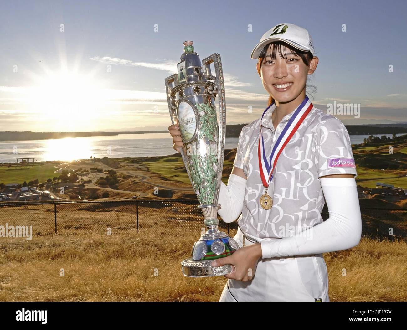 Japanese teenager Saki Baba celebrates with the victor's trophy after winning the U.S. Women's Amateur golf championship at the Chambers Bay course in University Place, Washington, on Aug. 14, 2022. The 17-year-old beat Canadian Monet Chun in the match-play final of the championship to become the first Japanese player to win the title since Michiko Hattori in 1985. (Kyodo)==Kyodo Photo via Credit: Newscom/Alamy Live News Stock Photo