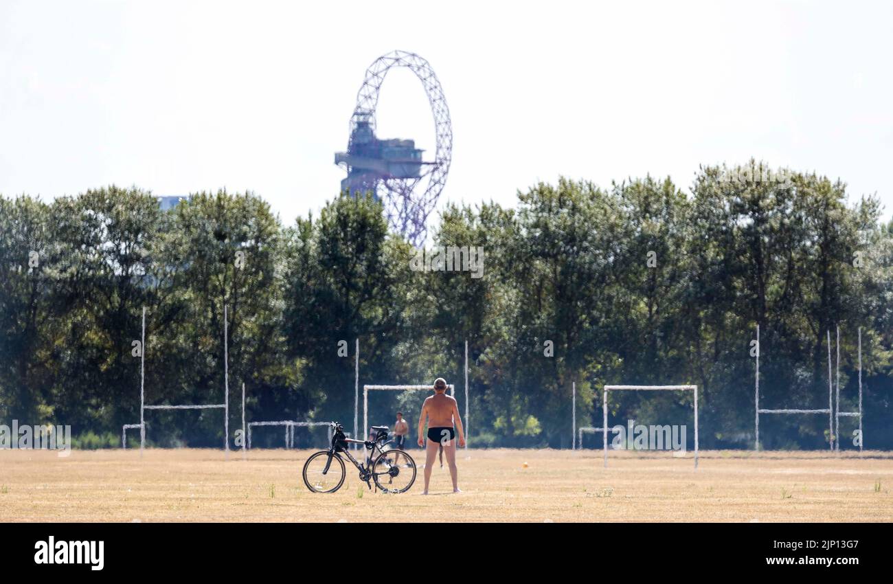 pic shows:  Sun worshipper  over Hackney Marshes today which ironically was bone dry and brown  Picture by Gavin Rodgers/ Pixel8000 Stock Photo