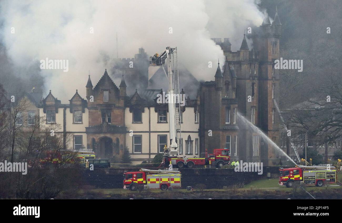File photo dated 18/12/2017 of firefighters at the scene following a fire at the Cameron House Hotel on the banks of Loch Lomond in Scotland. A fatal accident inquiry (FAI) into the deaths of two men in the fire at Cameron House in 2017 will commence on Monday. The inquiry, held at Paisley Sheriff Court, will look at issues around guest and fire safety at the hotel on the banks of Loch Lomond following the fatal fire in December 2017. Cameron House was previously fined £500,000 following the deaths of Simon Midgley, 32, and his partner Richard Dyson, 38, from London. Issue date: Monday August  Stock Photo