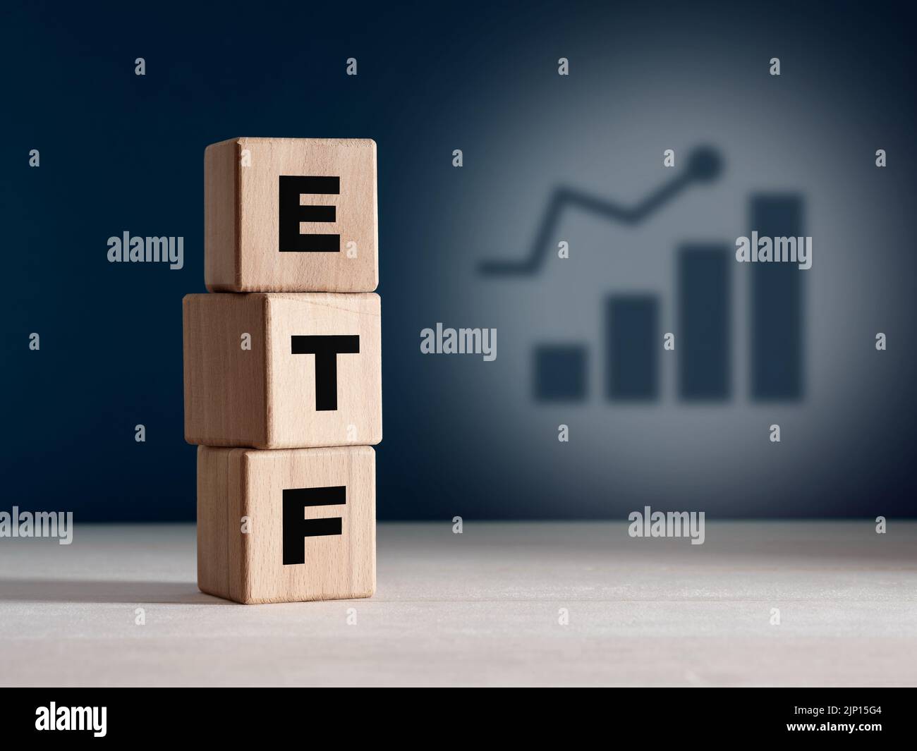 The acronym ETF Exchange Traded Fund on wooden cubes. Business stock market finance index fund concept. Stock Photo