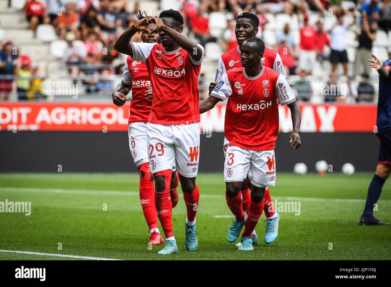 Folarin BALOGUN of Reims celebrate his goal with teammates during the  French championship Ligue 1 football match between Stade de Reims and  Clermont Foot 63 on August 14, 2022 at Auguste Delaune