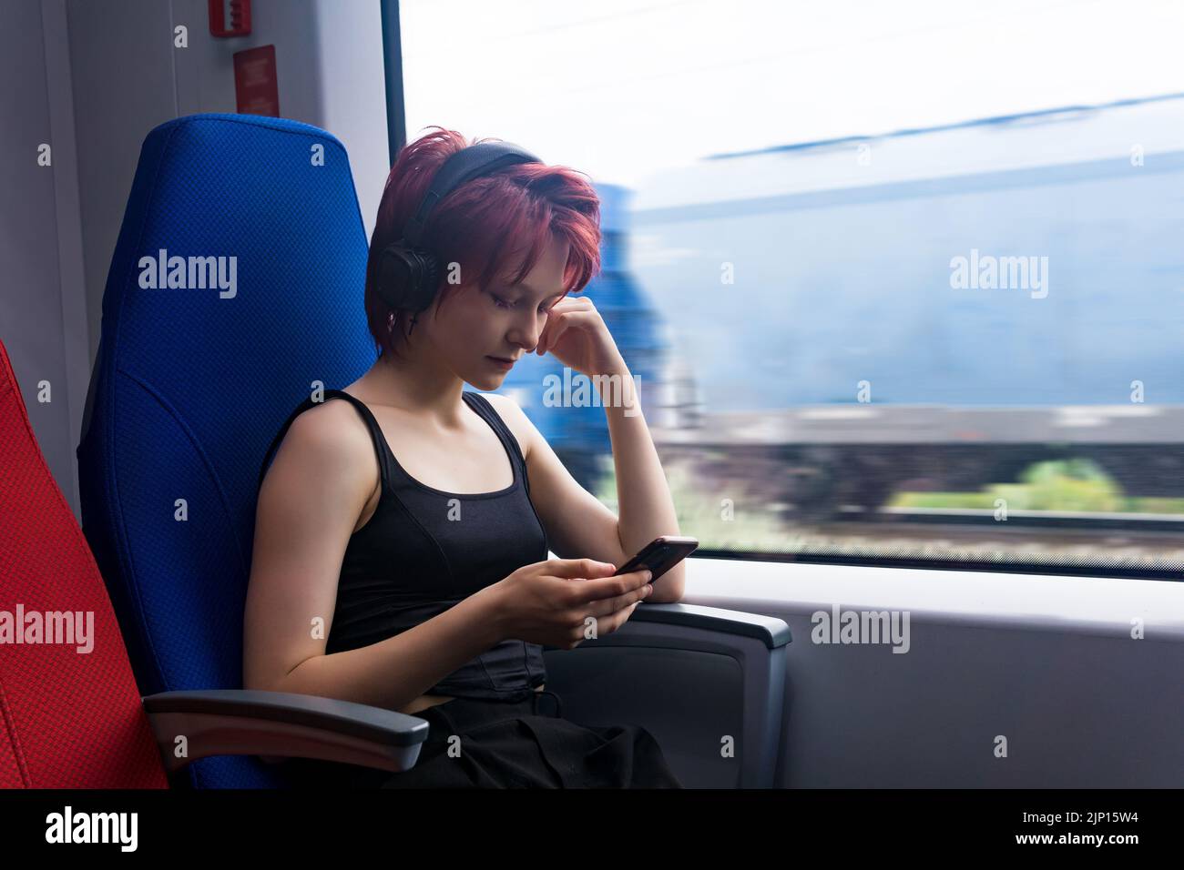 Woman on suburban train hi-res stock photography and images - Alamy