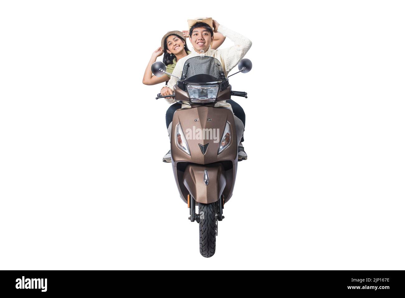 Asian couple with a hat sitting on a scooter isolated over white background Stock Photo