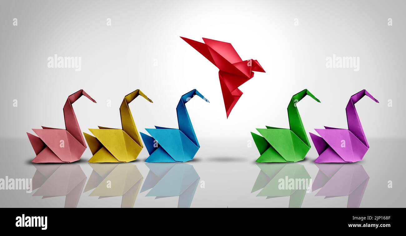 Innovative thinker concept and new idea thinking as a symbol of revolutionary innovation and inspiration metaphor as a group of paper swans. Stock Photo
