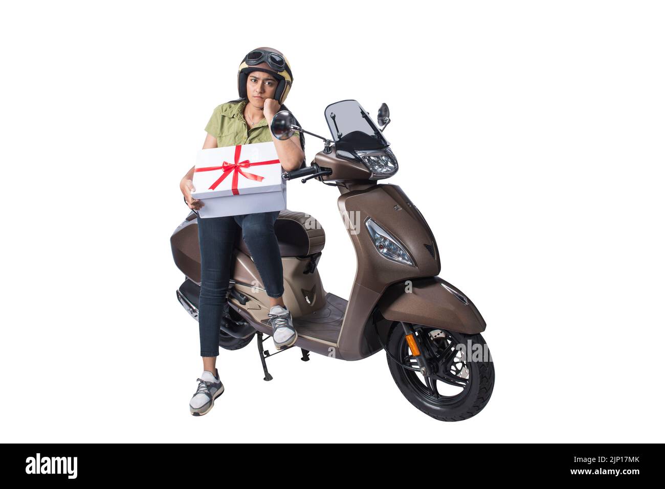 Asian woman with a helmet sitting on a scooter and carrying a gift box isolated over white background Stock Photo
