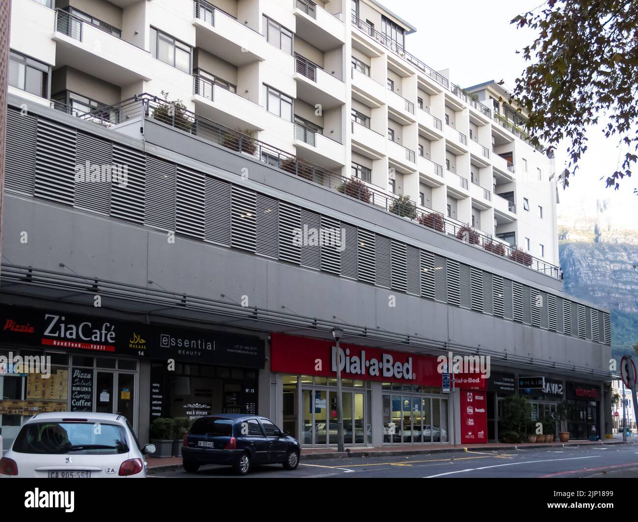 mixed residential and commercial property or real estate in urban suburb of Cape Town, South Africa consisting of shops and apartments Stock Photo
