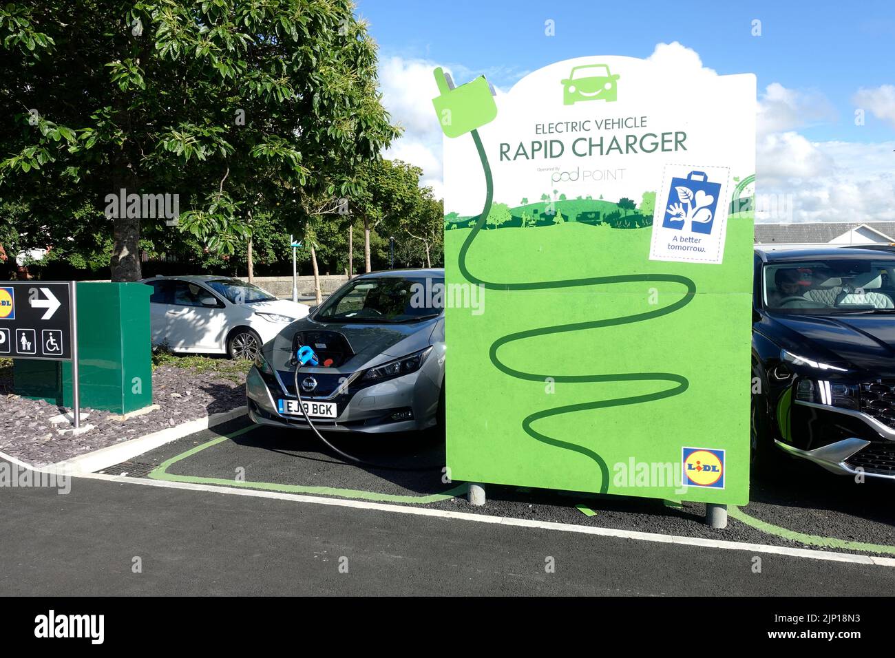 Electric vehicles charging at Lidl Rapid Charger Bideford Devon Stock