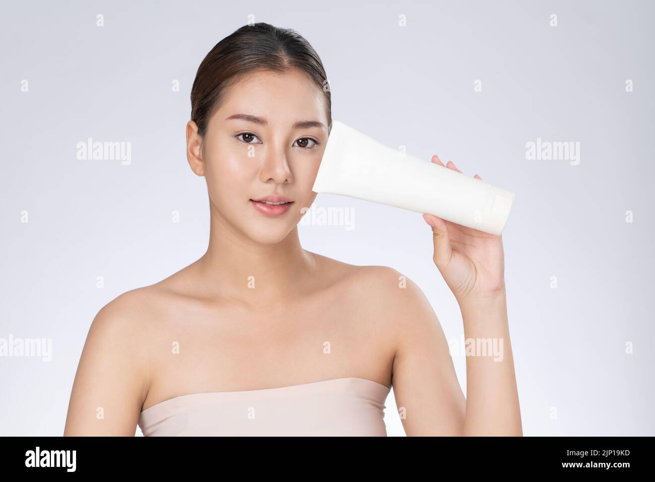 woman smiling holding mockup product for advertising text