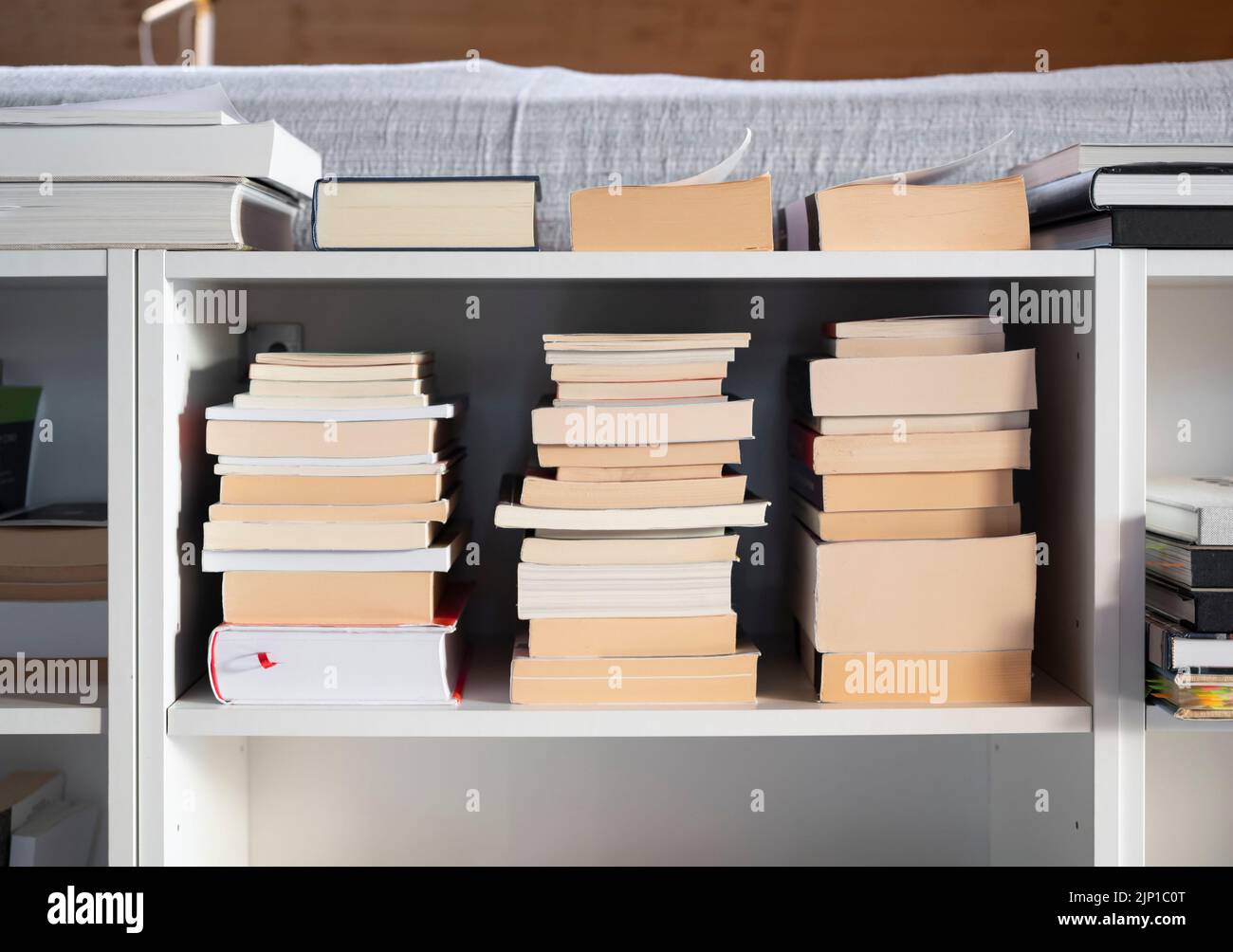 Books on the shelf at home Stock Photo Alamy