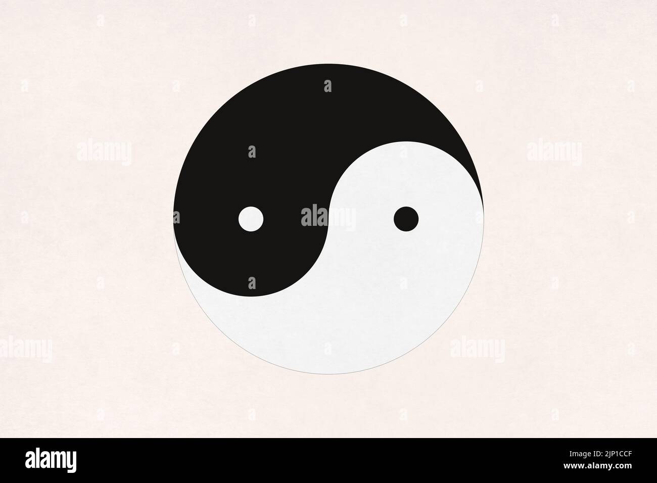Yin Yang printed in the middle of an old paper. Stock Photo
